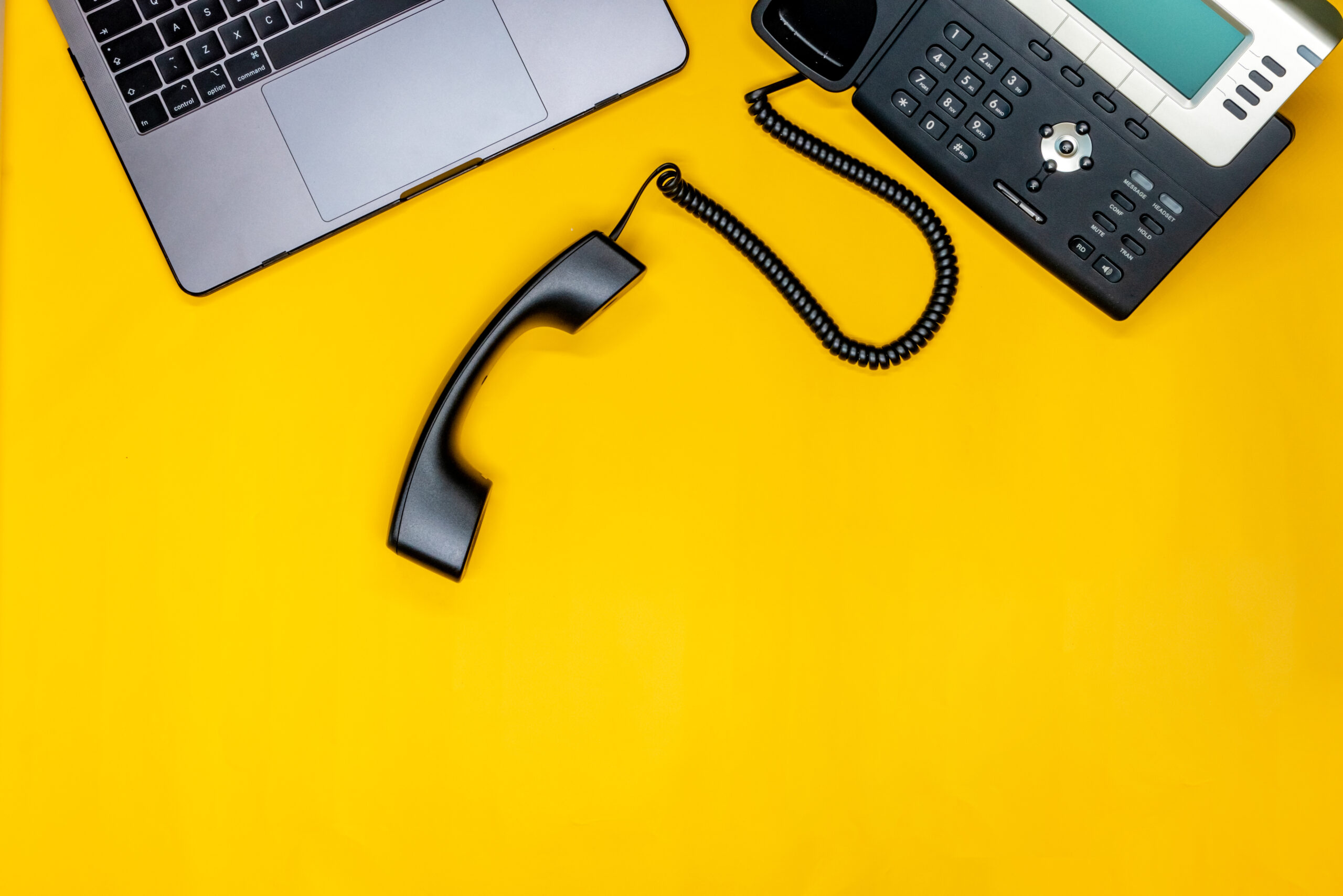 Workspace with a telephone and laptop